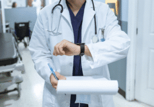 doctor looking at watch